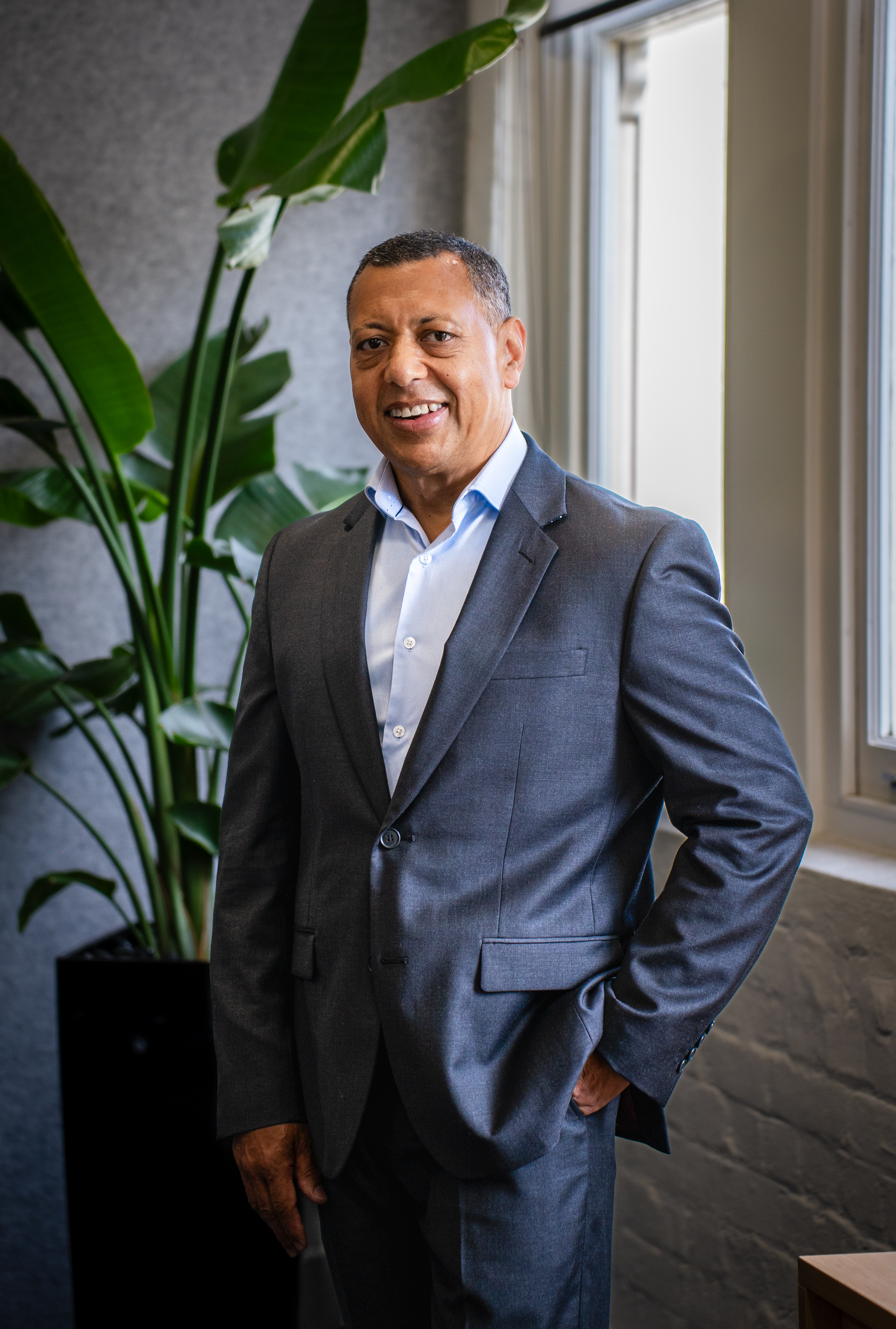 Brian Gabriels standing in a suit