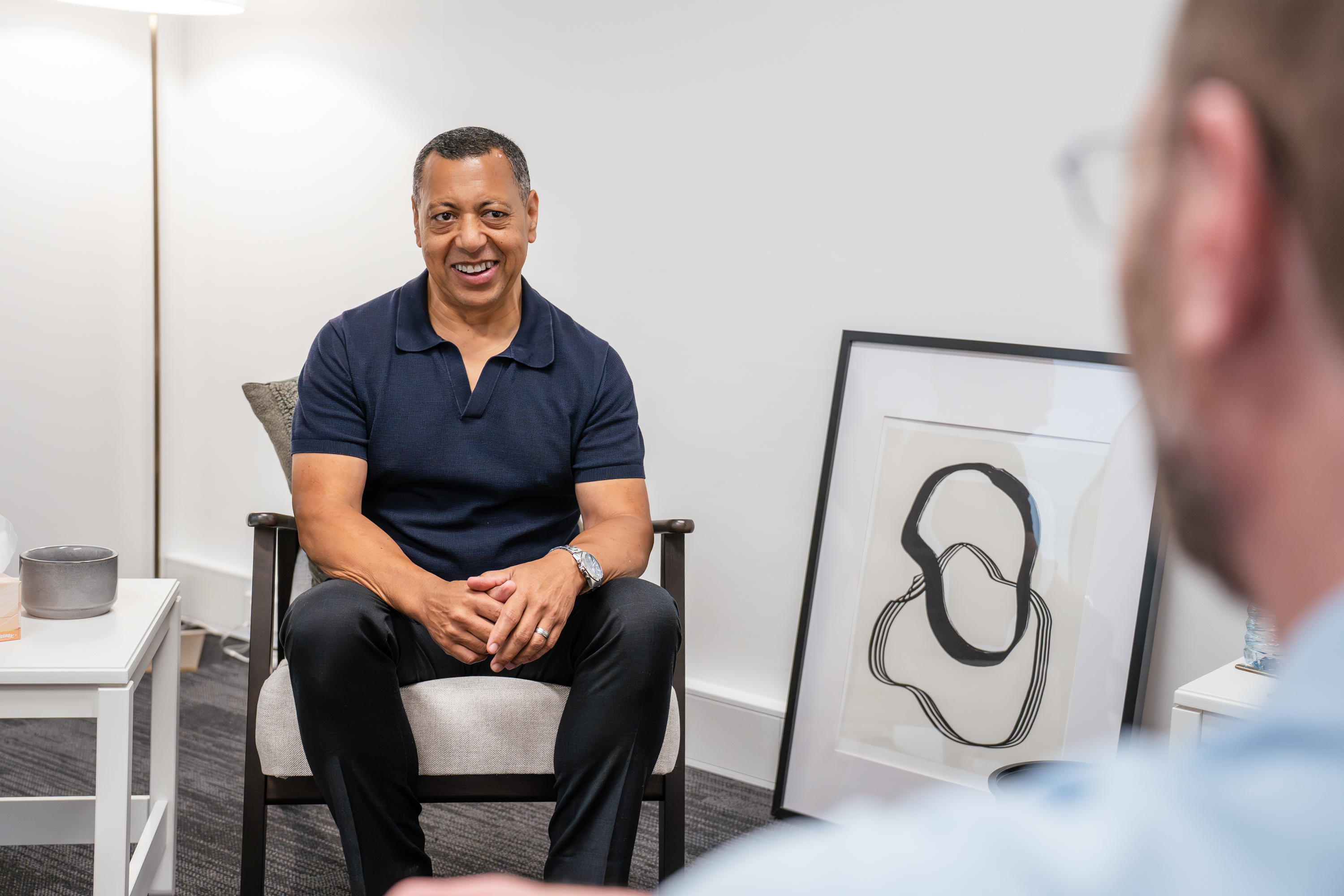 Brian seated in a supervision setting